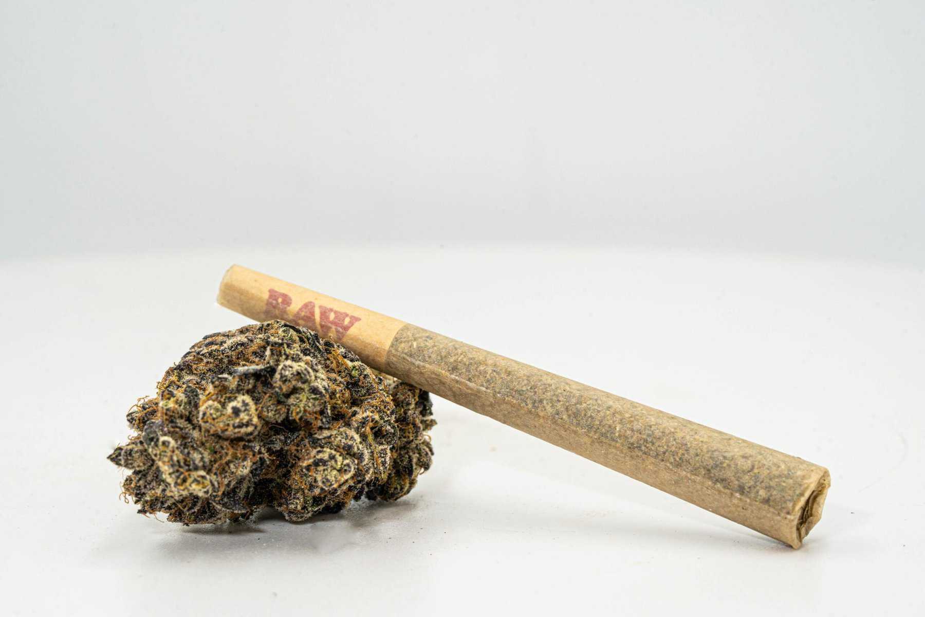 smoking a chronic guru preroll