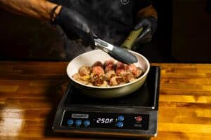 searing meatballs in a pan