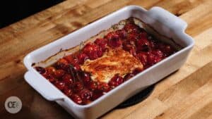 baked feta and cherry tomatoes before mixing
