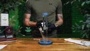 Freshly cleaned bong on a wooden table, used in a step-by-step guide on how to clean your bong for smooth sessions.