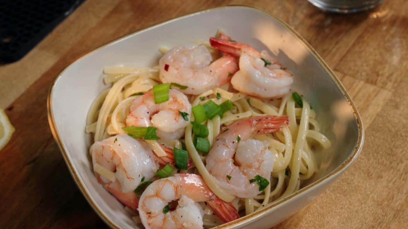 Infused Shrimp Scampi in a bowl on a wooden table