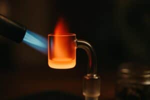 a torch over-heating a banger to orange