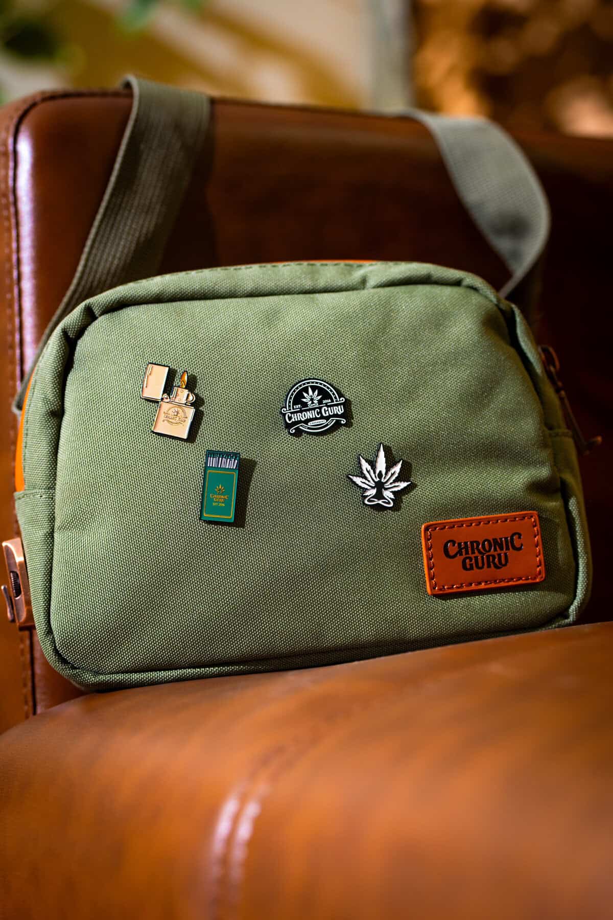 CG Collectible pins featured on the Loud Lock Crossbody in Sage.