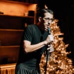 Some Christmas comedy night with a comedian on stage