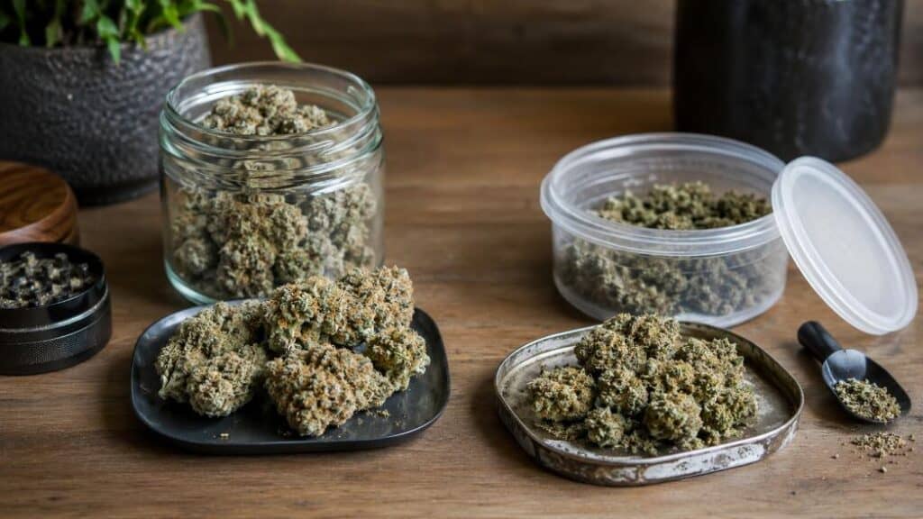 Two cannabis flower setups comparing premium and budget weed in a realistic tabletop scene